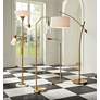 1_Possini Euro Raymond Warm Gold Adjustable Boom Arc Floor Lamp in scene