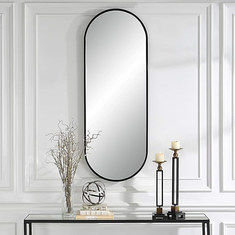 Image 1 Uttermost Varina 60" x 22" Tall Black Finish Oval Mirror in scene