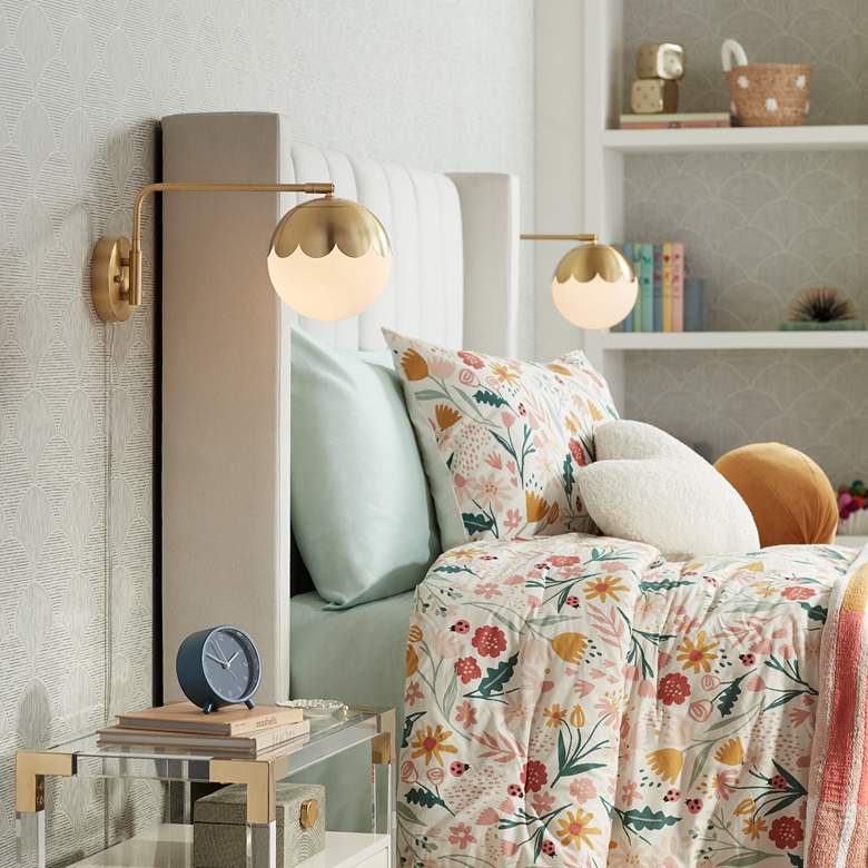 Image 1 Camila 8 1/4" Brass and Glass Globe Plug-In Wall Lamp in scene