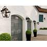 1_John Timberland Mira 21" High Black Finish Outdoor Lantern Wall Light in scene