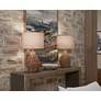 6_Uttermost Loophole 18" Brown Solid Wood Modern Accent Table in scene