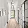 Thumbnail1 of Crystorama Payton 11 3/4" High Black Forged Wall Sconce in scene
