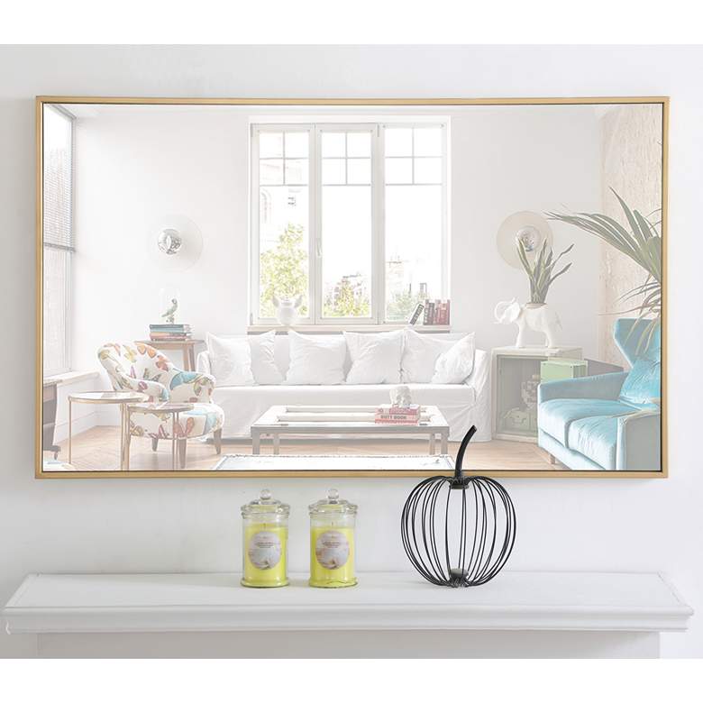 Image 1 24-in W x 40-in H Metal Frame Rectangle Wall Mirror in Brass in scene