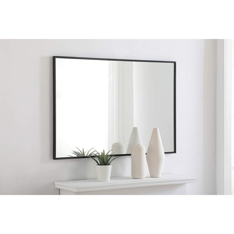 Image 1 28-in W x 42-in H Metal Frame Rectangle Wall Mirror in Black in scene