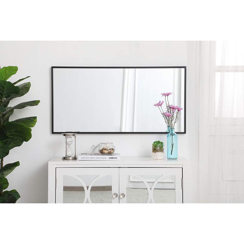 Image 1 18-in W x 36-in H Metal Frame Rectangle Wall Mirror in Black in scene