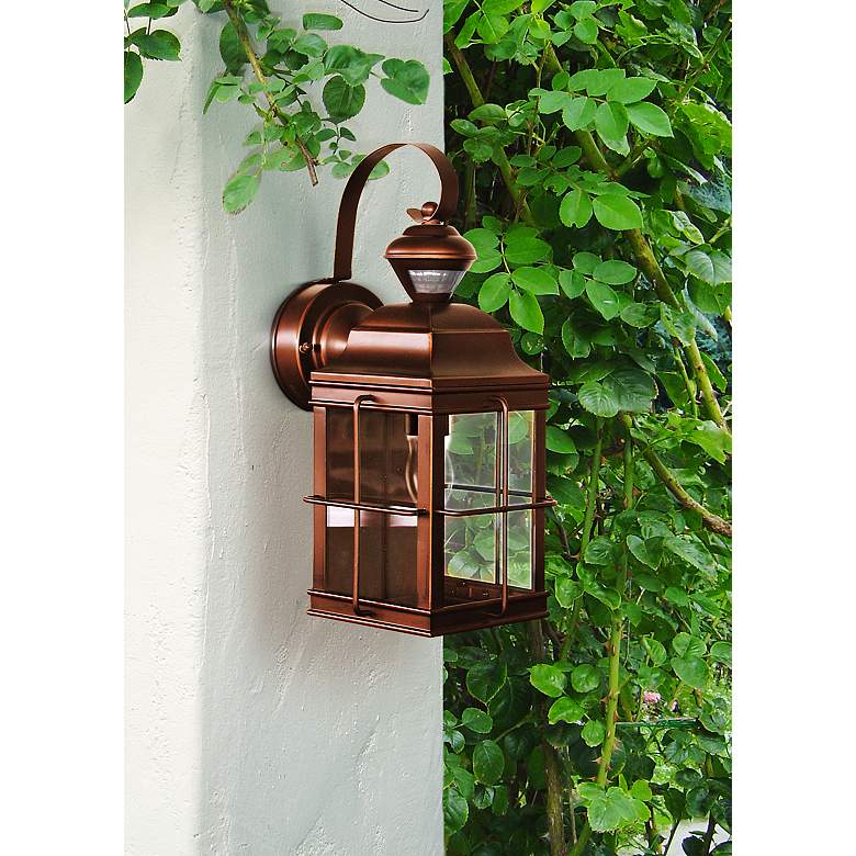 Image 1 Carriage House 14 3/4 inch Bronze Lantern Motion Sensor Outdoor Light in scene