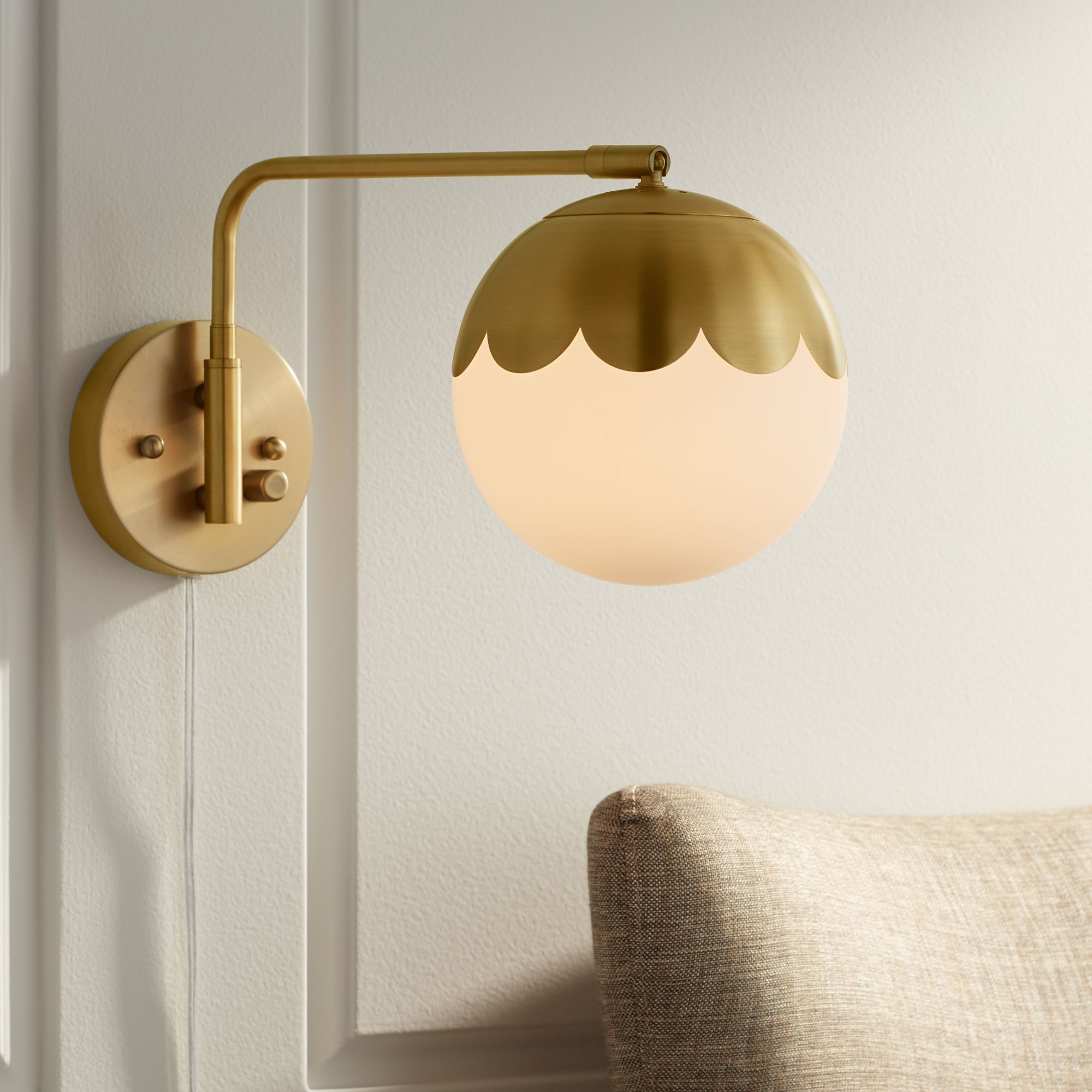 Watch A Video About the Camila Brass and Glass Globe Plug In Wall Lamp