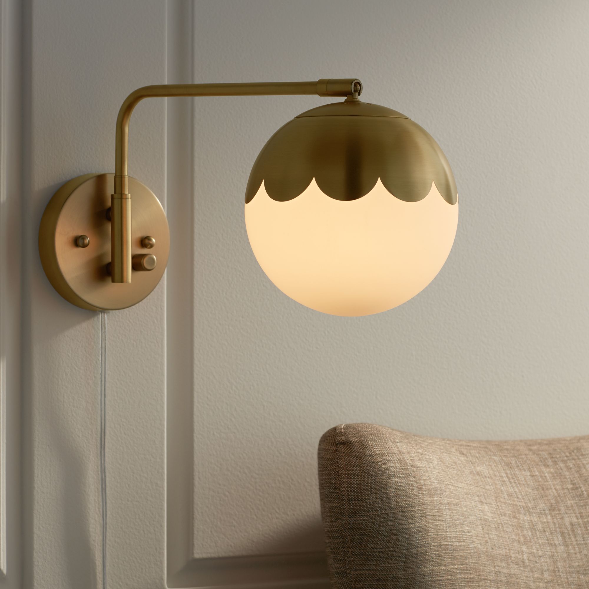 Watch A Video About the Camila Brass and Glass Globe Plug In Wall Lamp