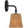 Watch A Video About the Keanu High Rattan and Matte Black Wall Sconce