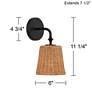 Watch A Video About the Keanu High Rattan and Matte Black Wall Sconce