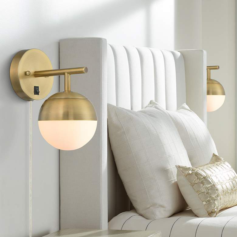 Image 1 360 Lighting Luna Antique Brass Globe Plug-In Wall Lamps Set of 2