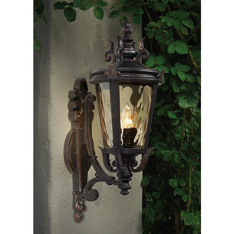 Image 1 John Timberland Casa Marseille 22" High Bronze Outdoor Wall Light in scene