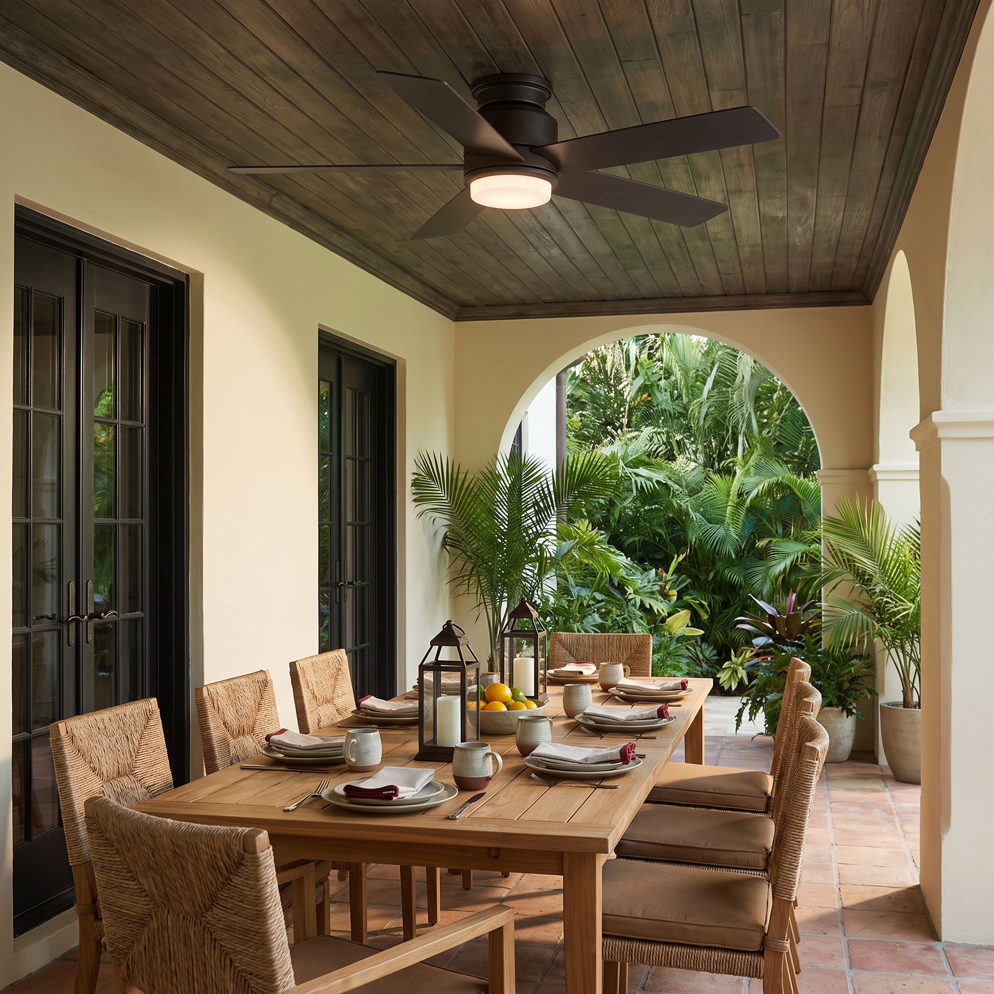 Image 1 52" Casa Vieja Grand Palm Bronze LED Damp Rated Hugger Fan with Remote in scene