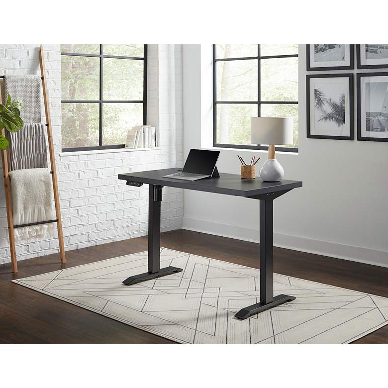 Image 1 Thermal Fused Black 47 inch Wide Adjustable Electric Lift Desk in scene