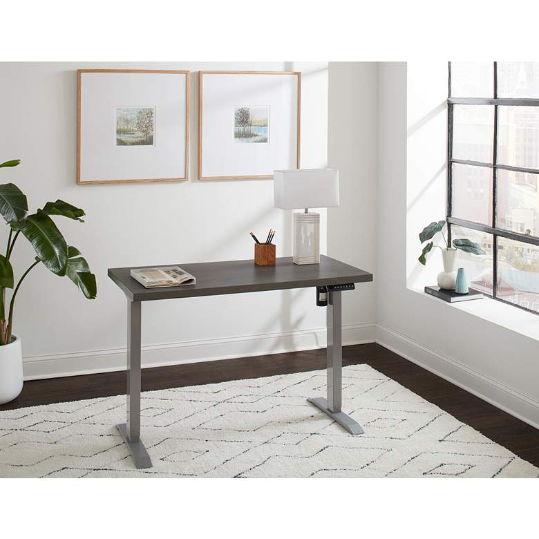 Image 1 Wood Grain Gray 47" Wide Adjustable Electric Lift Desk in scene
