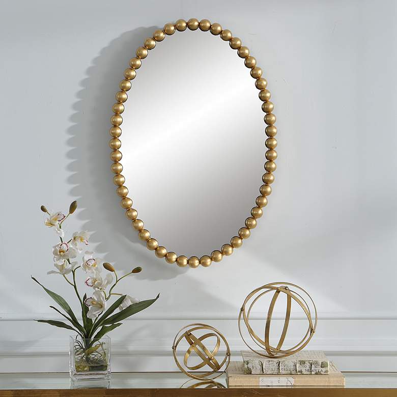 Image 1 Uttermost Serna Gold Leaf 20 inch x 30 inch Beaded Oval Wall Mirror in scene
