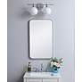 1_Evermore Silver Metal 18" x 30" Vanity Wall Mirror in scene