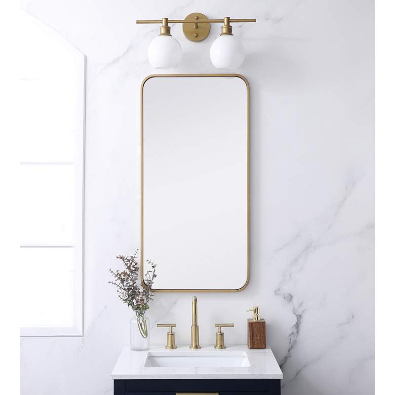 Image 1 18-in W x 36-in H Soft Corner Metal Rectangular Wall Mirror in Brass in scene
