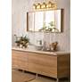1_Beckett 34" Wide Olde Brass 4-Light Vanity Bath Light in scene