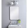 1_Evermore Silver Metal 20" x 30" Vanity Wall Mirror in scene