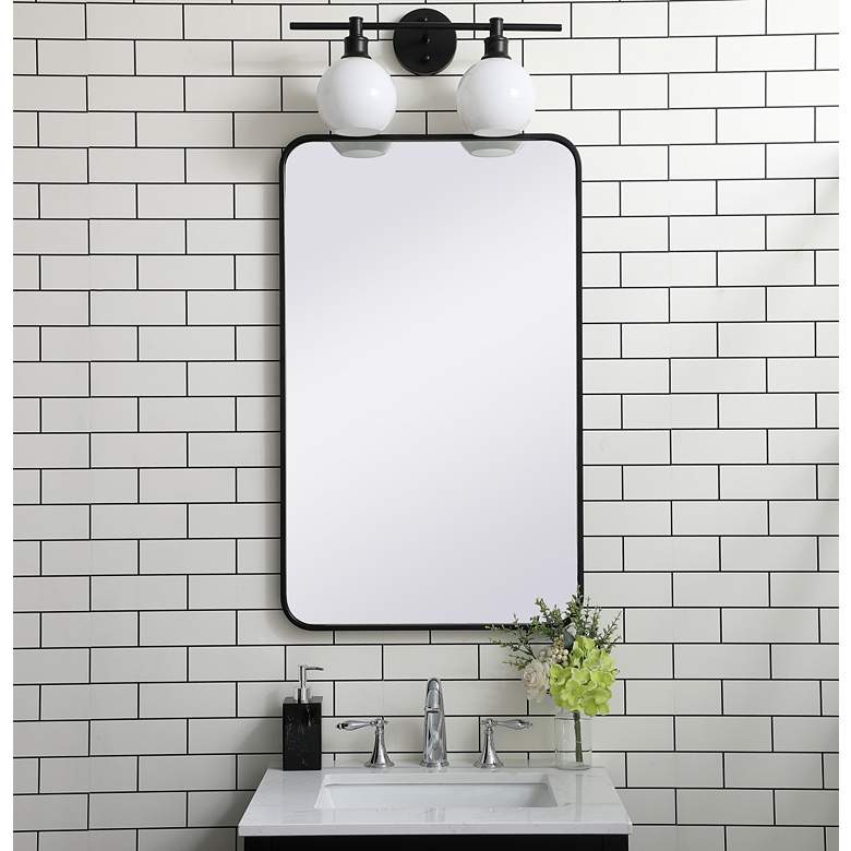 Image 1 Evermore Black Metal 22" x 36" Rectangular Wall Mirror in scene