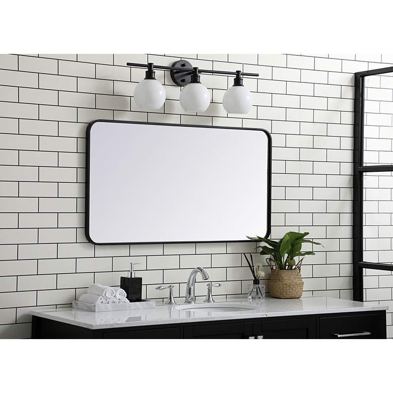 Image 1 Evermore Black Metal 22" x 40" Rectangular Wall Mirror in scene