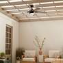 52" Kichler Tide Weather+ Olde Bronze LED Wet Remote Ceiling Fan in scene