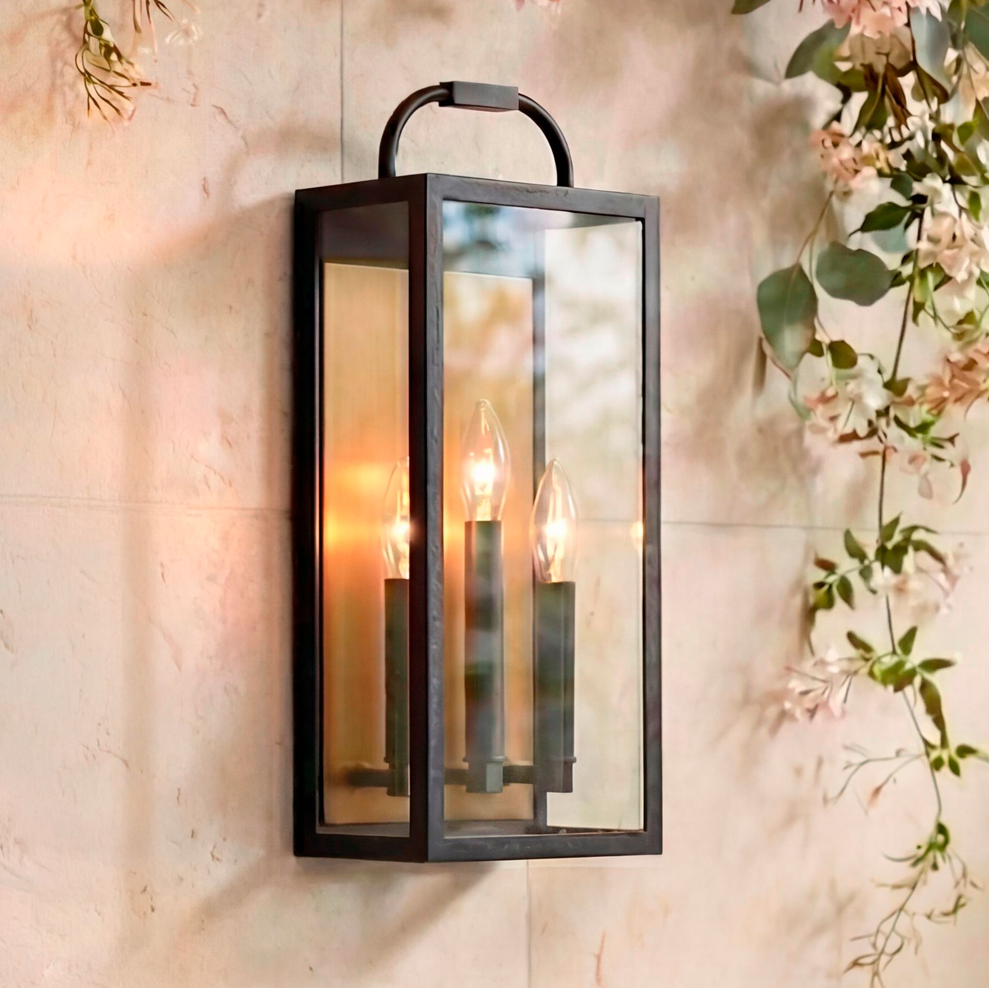 Image 1 Montague 18"H Sand Black and Antique Brass 3-Light Outdoor Wall Light in scene