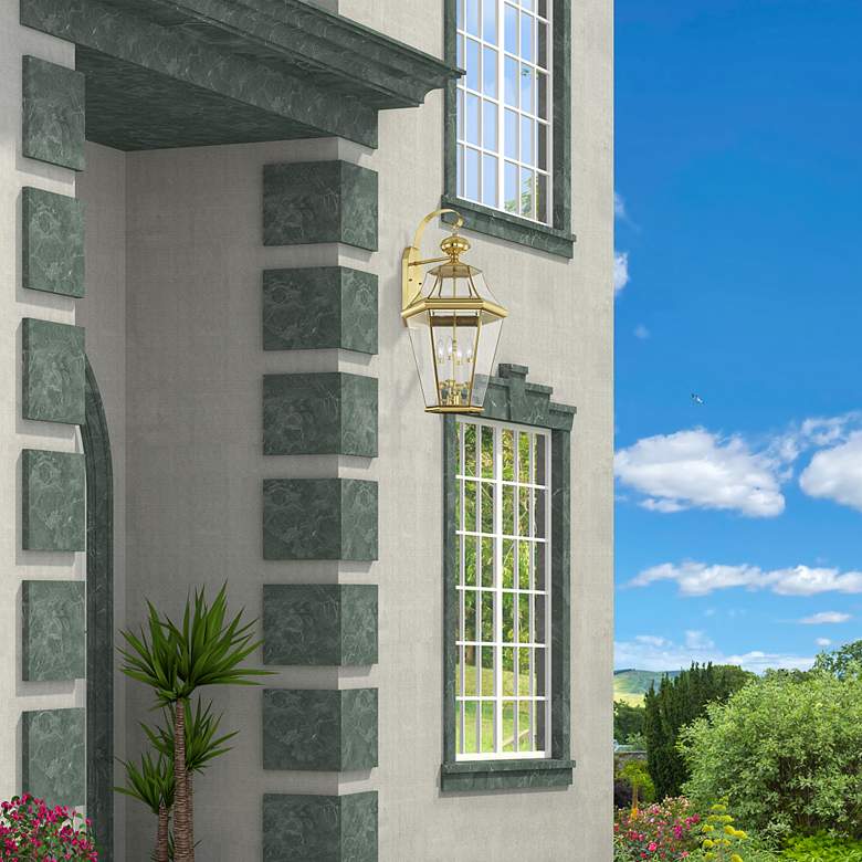 Image 1 Georgetown 30"H Polished Brass Outdoor Lantern Wall Light in scene