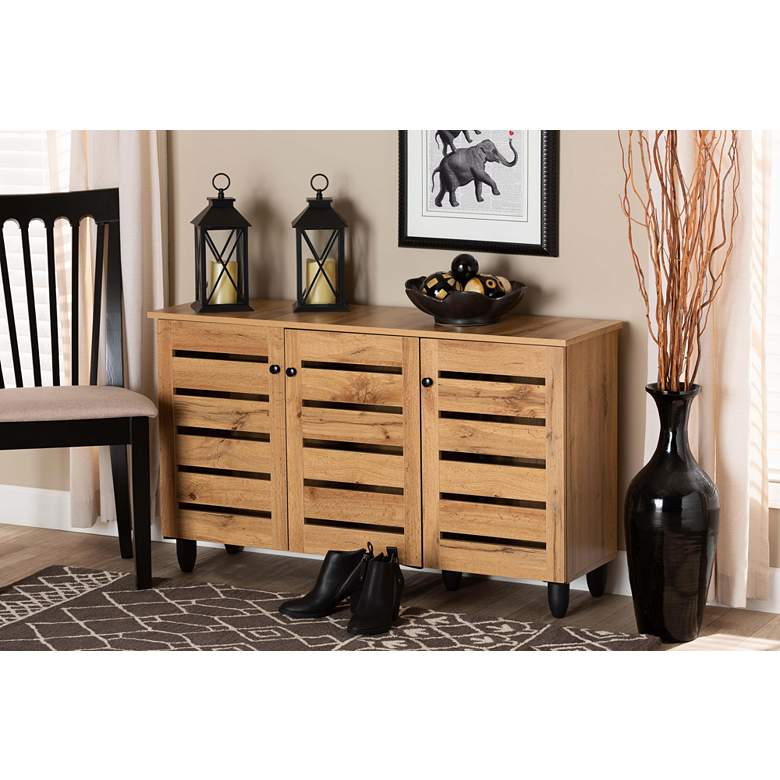 Image 1 Gisela 44 1/2"W Oak Brown Wood 3-Door Shoe Storage Cabinet in scene