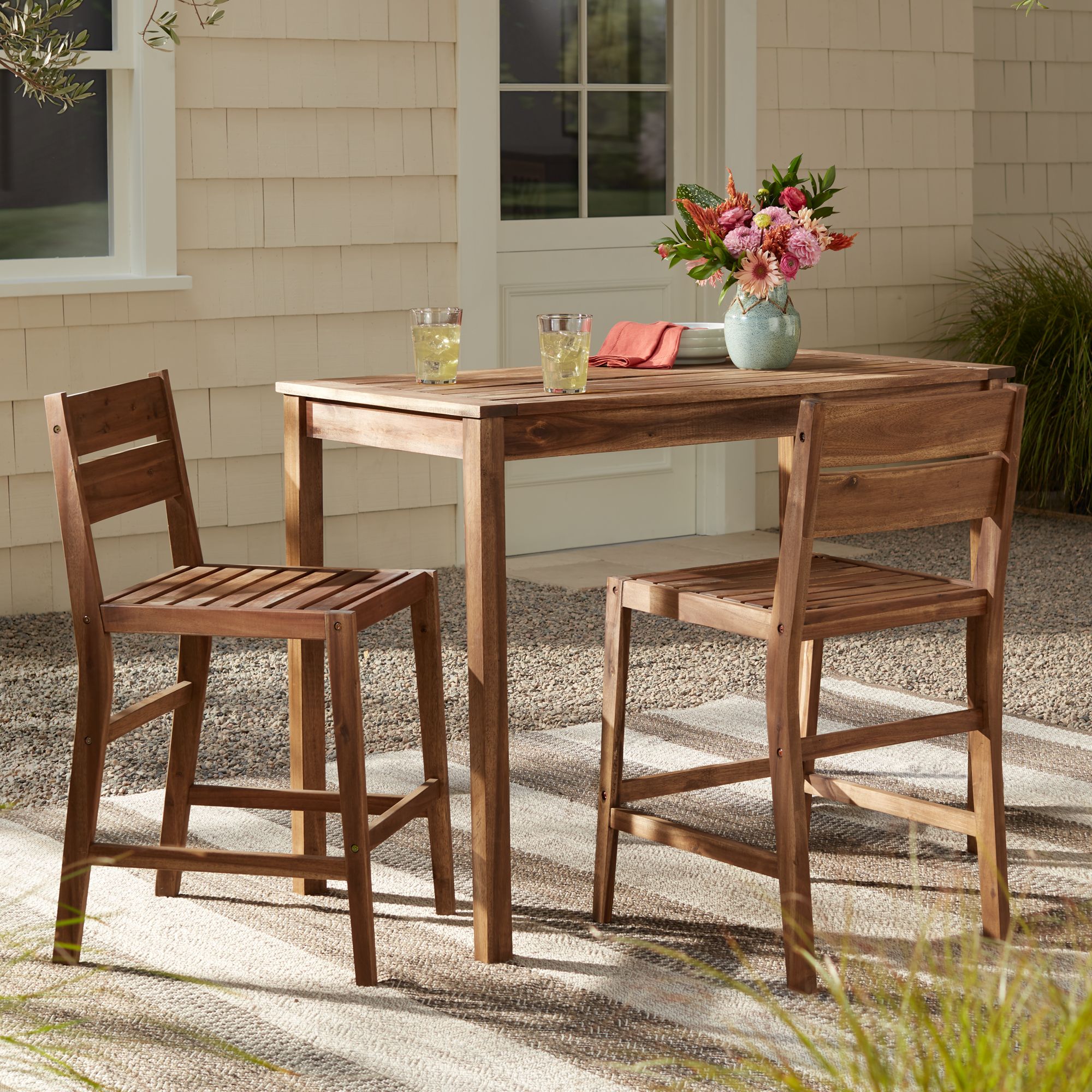 Image 1 Nova 24" Natural Wood Outdoor Counter Stools Set of 2 in scene
