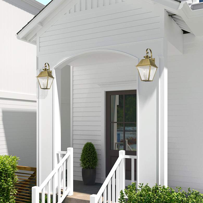 Image 1 Mansfield 22" High Antique Brass 3-Light Outdoor Wall Light in scene