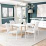 1_Aren 63" Wide Matte White Natural Wood Dining Table in scene