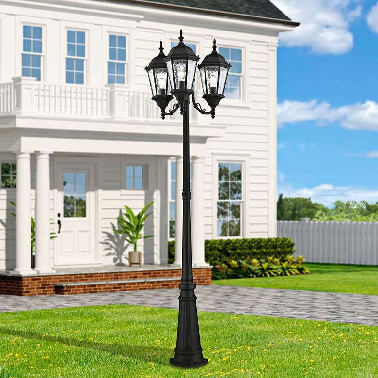 Image 1 Livex Hamilton 86" High Textured Black Outdoor Post Light with Base in scene