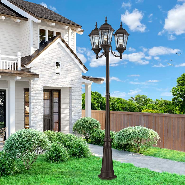 Image 1 Livex Hamilton 86" High Bronze Aluminum 3-Head Outdoor Post Light in scene