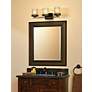 Thumbnail1 of Kichler Hendrik 24" Wide 3-Light Bronze Bathroom Light Fixture in scene