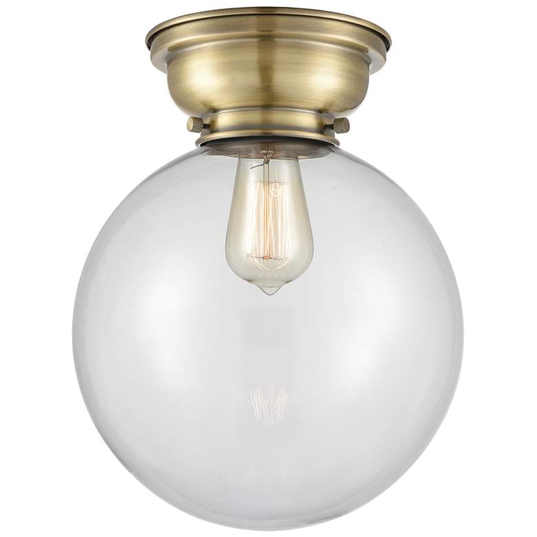 Image 1 Aditi Beacon 10" Antique Brass Flush Mount w/ Clear Shade