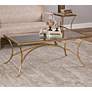 Alayna 48" Wide Antiqued Gold Rectangular Coffee Table in scene