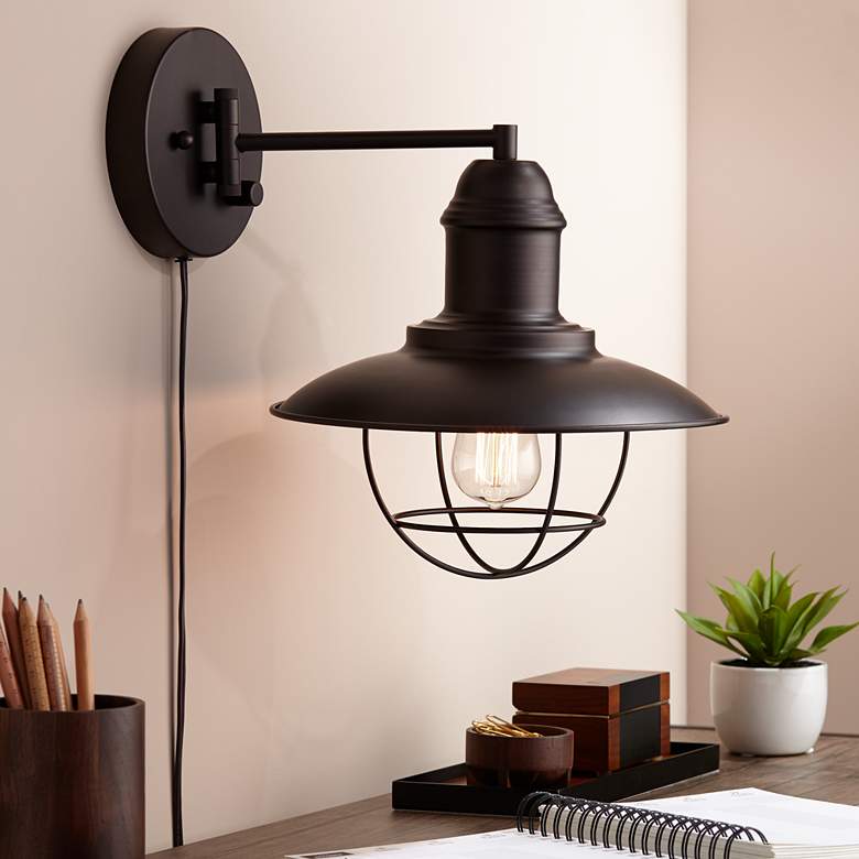 Image 1 Amqui Bronze Cage Shade Plug-In Swing Arm Wall Lamp