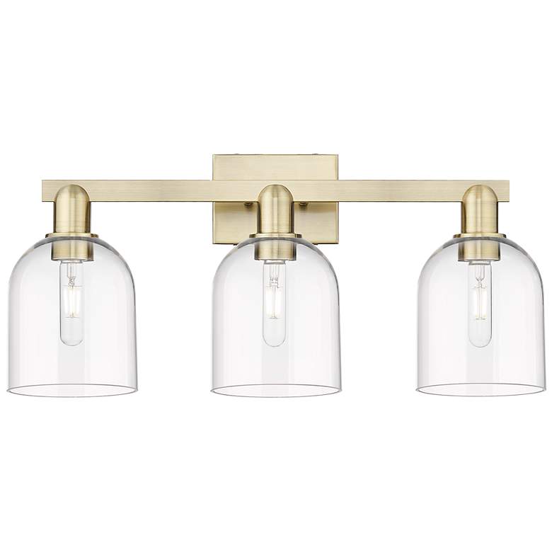 Image 1 Arcadia Bella 25"W 3 Light Antique Brass Vanity Light With Clear Shade