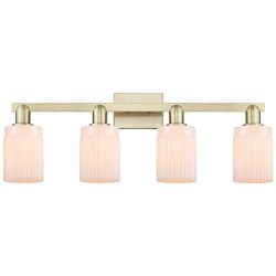Arcadia Hadley 32"W 4 Light Brass Vanity Light With Matte White Shade
