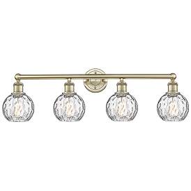 Image1 of Athens 33"W 4 Light Antique Brass Bath Light With Clear Water Glass Sh