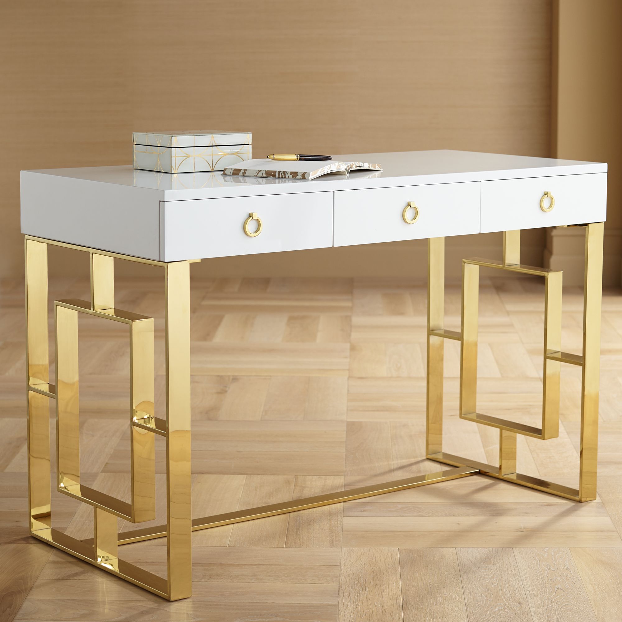 gold and white writing desk