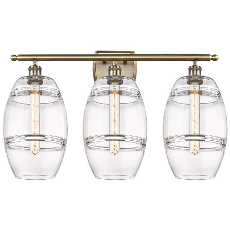 Image 1 Ballston Vaz 28" Wide 3 Light Antique Brass Bath Light With 8" Cl