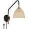 Barnes and Ivy Vega Bronze and Brass Rattan Shade Plug-In Wall Lamp