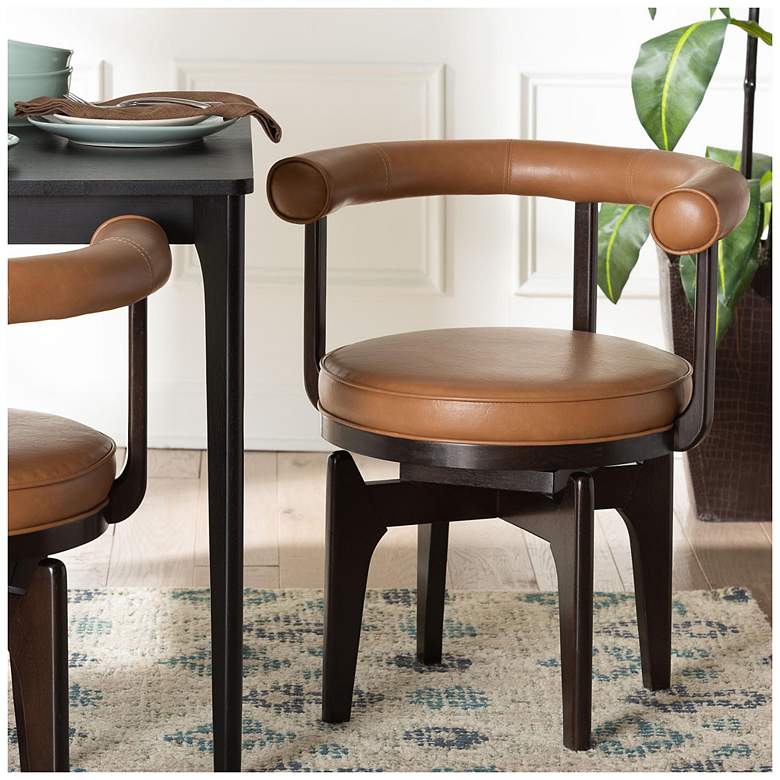 Image 1 Baxton Studio Delacruz Swivel Dining Chair with Faux Leather Upholstery
