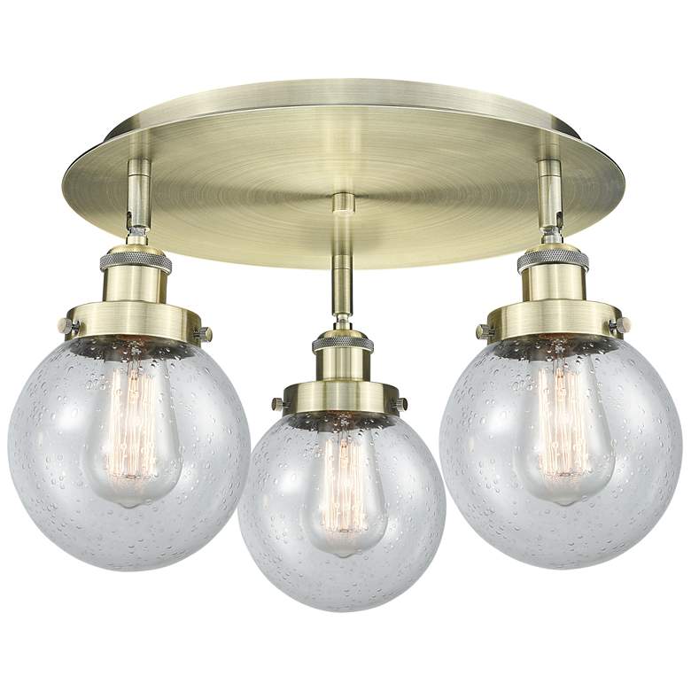 Image 1 Beacon 17.75" Wide 3 Light Antique Brass Flush Mount With Seedy Glass