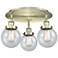 Beacon 17.75" Wide 3 Light Antique Brass Flush Mount With Seedy Glass