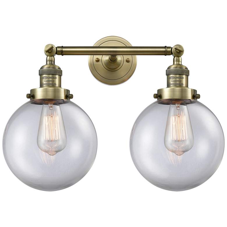 Image 1 Beacon 19" 2-Light Antique Brass Bath Light w/ Clear Shade