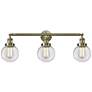 Beacon 3 Light 30" LED Bath Light - Antique Brass - Clear Shade